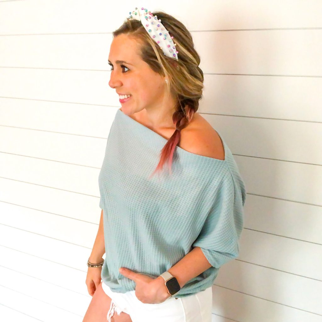 cute summer outfit- turquoise off the shoulder waffle thermal, multi colored pearl white headband with white distressed shorts