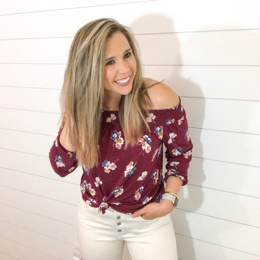 cute casual fall transition outfit- burgundy floral off the shoulder top with button front white jeans